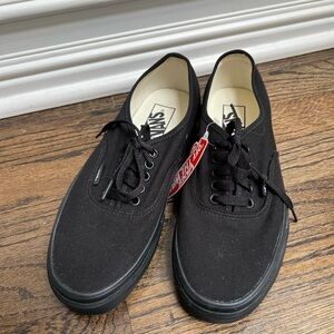 New black canvas lace up Vans.